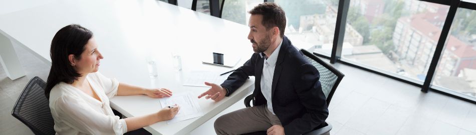 Image of man and woman at desk